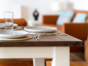 a table with plates and glasses on top of it at Sunset Beach - Uk42994 in Woolacombe +20 photos