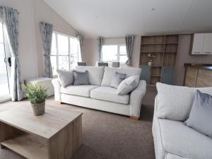 a living room with a couch and a coffee table at White House in St Asaph