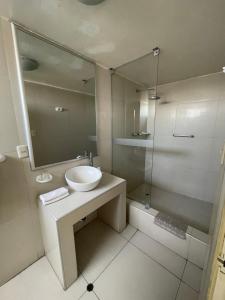 a bathroom with a sink and a shower at Hotel Premier in Tacna