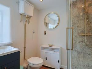 a bathroom with a shower and a toilet and a sink at 6 Bedford Place in Bridport +22 photos
