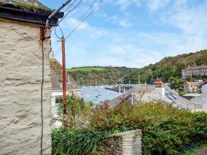 a view of a harbor with boats in the water at Gypsett in Polruan