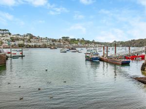 a group of boats are docked in a harbor at Gypsett in Polruan