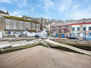 an empty street in a town with buildings at Gypsett in Polruan +18 photos