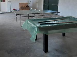 a green piano sitting in a room with two tables at Degnish Farmhouse - Swwu in Kilmelfort