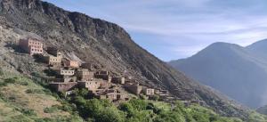 a village on the side of a mountain at Auberge amazrane in Matat