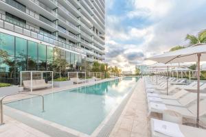 an image of a swimming pool at a building at 72 Park by Nomada Residences in Miami Beach
