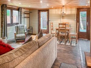 a living room with a couch and a table at The Lodge - Uk50721 in Aldbrough