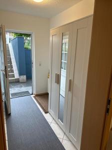 a hallway with a door leading into a room at Ferienwohnung Kraus 2-4 Pers in Herbolzheim +35 photos