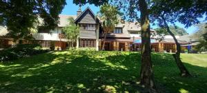 a house with a green lawn in front of it at AVillaT15SelborneGolfEstatePennington in Pennington