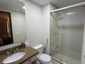 a bathroom with a shower and a toilet and a sink at Hotel Alameda Campinas Paulista in São Paulo