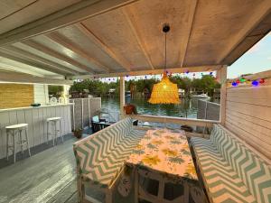a patio with a table and chairs on a deck at Ada Gioia in Ulcinj