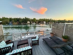a deck with chairs and a view of a lake at Ada Gioia in Ulcinj +7 photos