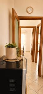 a kitchen with a plant on top of a stove at Luna House - Key to Villas in Valledoria +16 photos