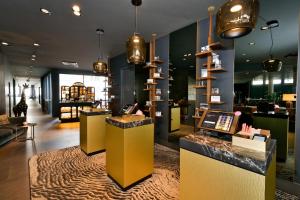 a lobby of a store with a counter in a store at Hotel AMANO Rooms & Apartments in Berlin
