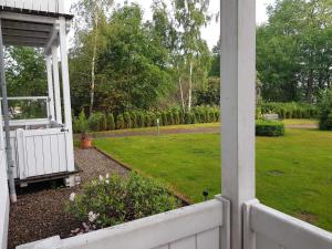 a view of a yard from the porch of a house at Residenz Seeblick Whg 4, mit Gartenzugang in Ostseebad Sellin