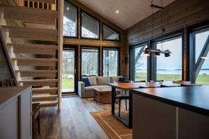 a kitchen and living room of a tiny house at Sea Haven Villa in Trutberget