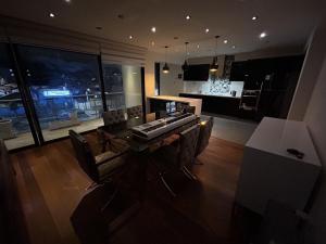 a living room with a table with a keyboard on it at Luxury apartment with park views in Huancavelica