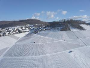 an aerial view of a field covered in snow at Gästehaus Winzerhof am Schlierbach in Weiler bei Weinsberg