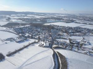 an aerial view of a town covered in snow at Gästehaus Winzerhof am Schlierbach in Weiler bei Weinsberg