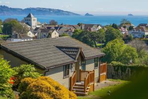 a house with a roof with a view of a town at Beverley Park in Goodrington