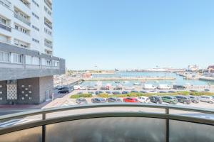 a view of a marina from the balcony of a building at Holiday Inn Calais - Centre Car Ferry by IHG in Calais