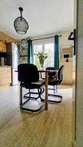 a living room with a table and two chairs at Mont Joly Gîte in Soumont-Saint-Quentin