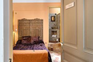 a bedroom with a bed in a room at Domaine du chemin Royale in Saint-Germain