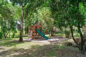 a playground in a park with a slide at Domaine du chemin Royale in Saint-Germain