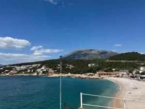 a beach with a soccer ball in the water at S Pearl Lux in Utjeha +22 photos