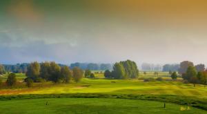 a view of a golf course with a green at VILLA AQUILA _ EG_Fewo in Göhren-Lebbin