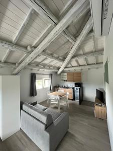 a living room with a couch and a table at Le Nogare in Abano Terme