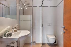 a bathroom with a shower and a sink and a toilet at Schloss Gravetsch in Villandro +80 photos