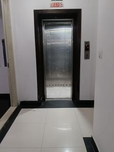 a door to a shower in a building at Hotel Siam International Karol Bagh New Delhi in New Delhi