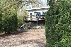 a house in the middle of a forest at Au repos de Zoé in Waulsort