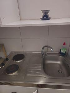 a kitchen counter with a sink and a stove at ΕΥΡΙΠΟΣ in Kritharia +16 photos