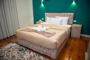 a bedroom with a large bed with two towels on it at Cairo Center in Cairo +21 photos