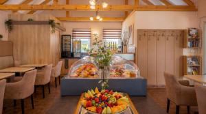 a room with a display of fruit on a table at Hotel Dolce Vita in Balatonkenese