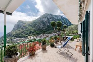 a balcony with a view of a mountain at Ulivello House Sea View in Massa Lubrense
