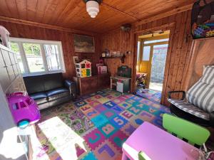 a living room with a couch and a rug at Vila Šik in Nové Město na Moravě