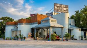 a shark resort with a sign on top of it at Shakti Resort in Behror