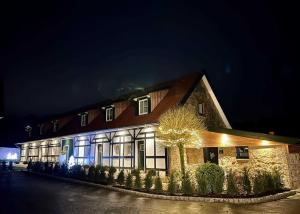 a building that is lit up at night at DRIEHOF LifeStyle Classic Apt 5 in Tecklenburg