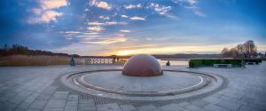 a sculpture in a park with a sunset in the background at Fewo`s Mehlberg Binz in Binz