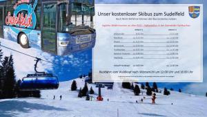 a sign for a ski lift with a ski slope at Ferienwohnung Dehnert in Fischbachau