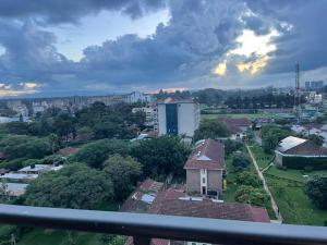 a view of a city with a building and trees at Xenia Backpackers in Nairobi
