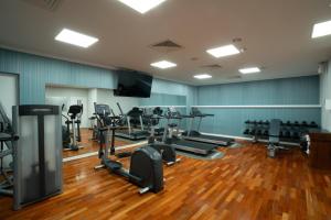 a gym with several treadmills and tread machines at Radisson Blu Hotel Wroclaw in Wrocław