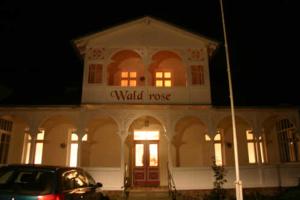 a building with the words world roosevelt on it at Pension Waldrose in Ostseebad Sellin +92 photos