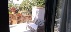 a view of a porch with a chair on a patio at B&B Josefine in Marina di Camerota