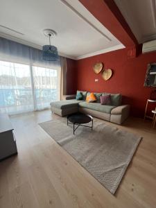 a living room with a couch and a rug at Buena Vista Hotel&Restaurant in Marmaris