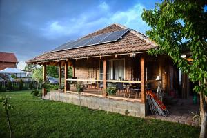 a house with solar panels on the roof at Etno kuca Drina in Loznica