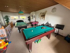 a room with two pool tables in a room at Rašovka - Bílý dům in Šimonovice